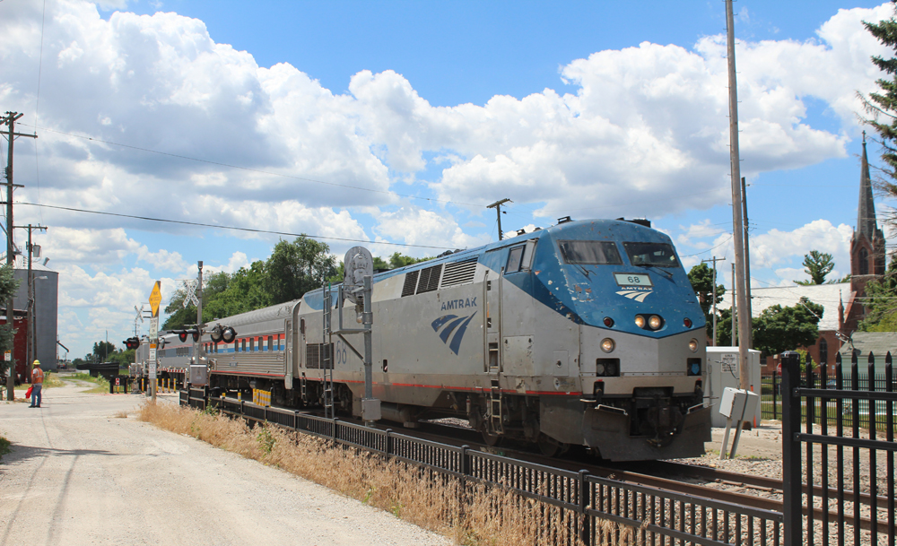 Passenger train passes signals