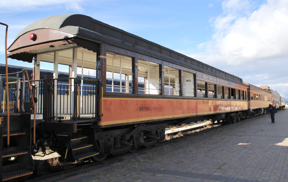 Open-air observation car in brown and orange paint