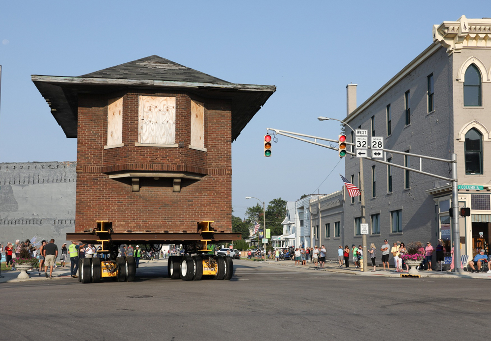 Brick building being moved down street