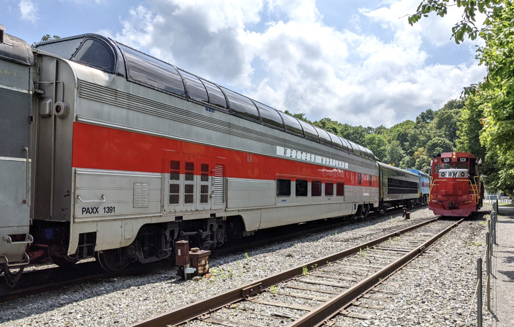 Full-length dome car with red stripe