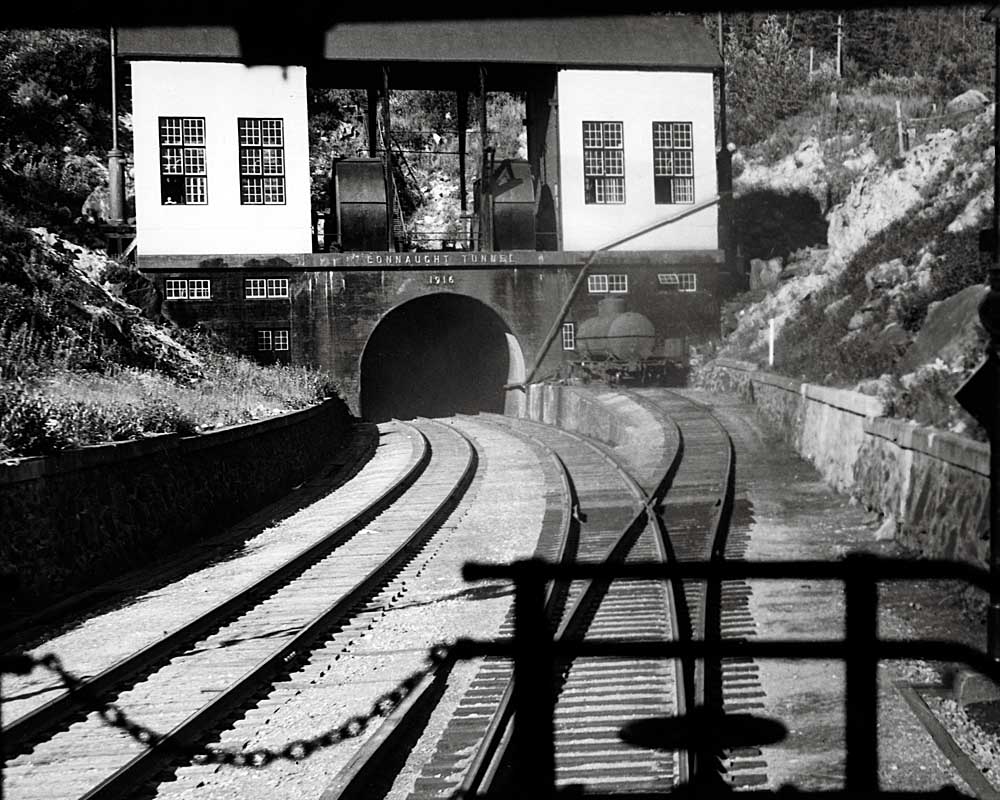 View of tunnel portal off rear platform of passenger car