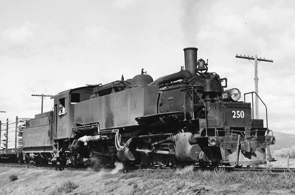 Black-and-white three-quarter view of 2-6-6-2 steam locomotive
