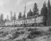 Black-and-white view of four-unit streamlined diesel locomotive