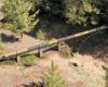 Model passenger train on bridge