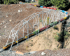 Model train on a truss bridge