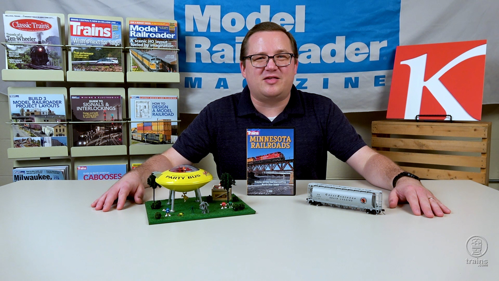 Cody Grivno sitting on the set of Codys Office with three products to review