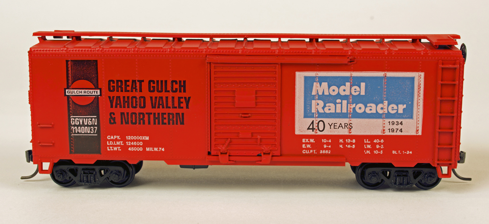 Athearn HO scale 40-foot boxcar kit painted orange and black and lettered for Model Railroader and the Great Gulch, Yahoo Valley & Northern.