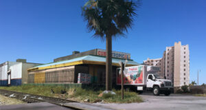 A model produce store next to tracks