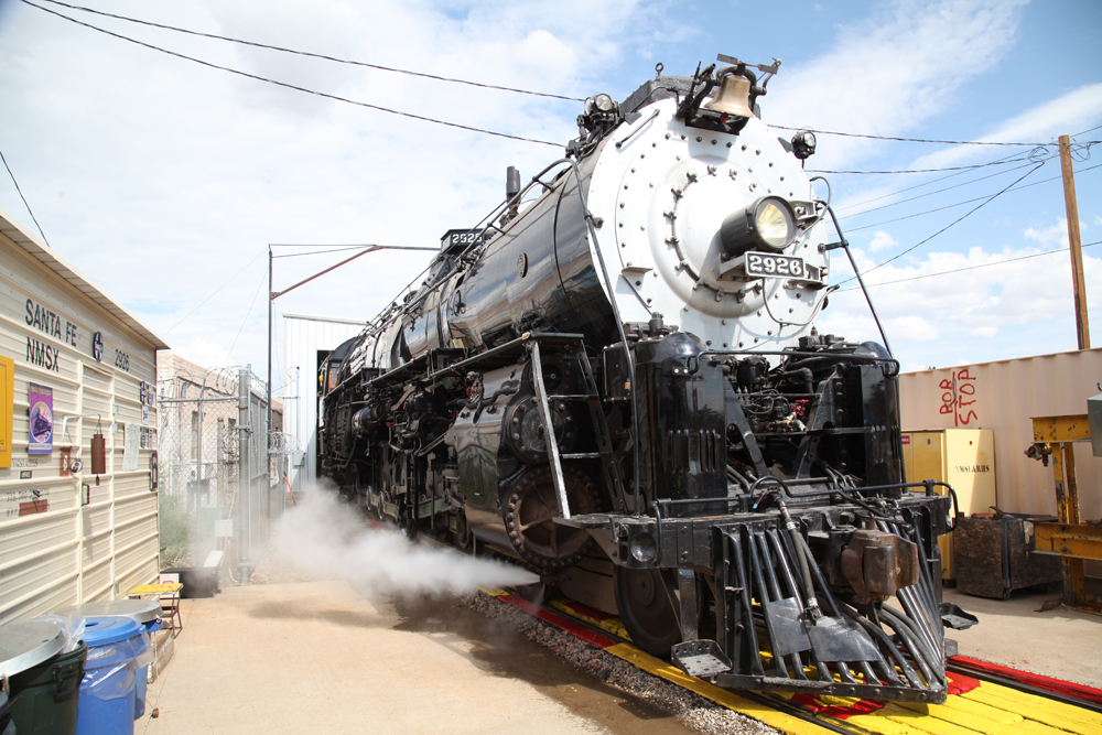 Steam locomotive blowing out steam