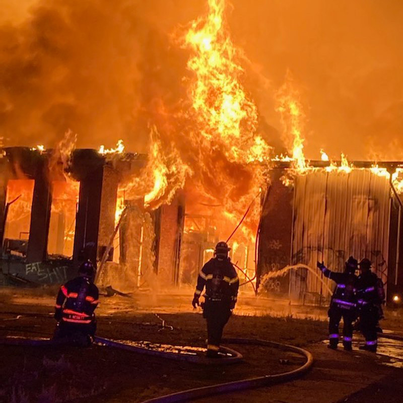 Firemen and burning building