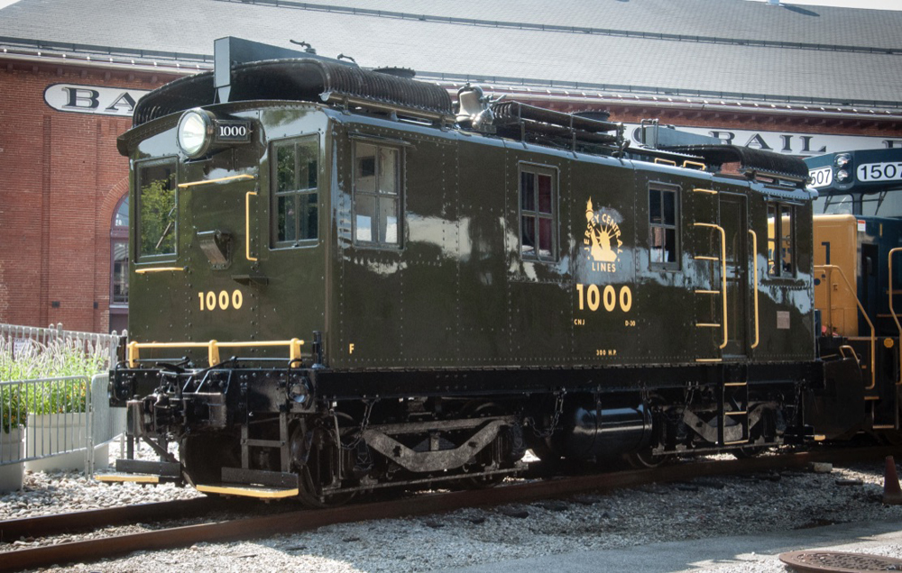 Olive green boxcab locomotive