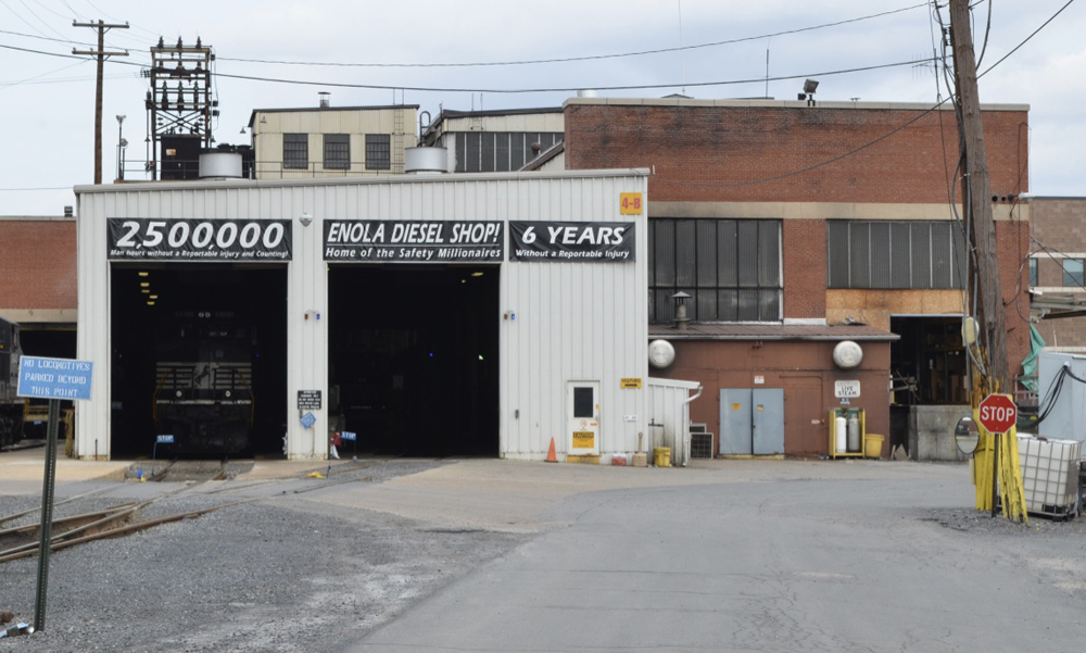 Brick shop building with safety signs over doorways