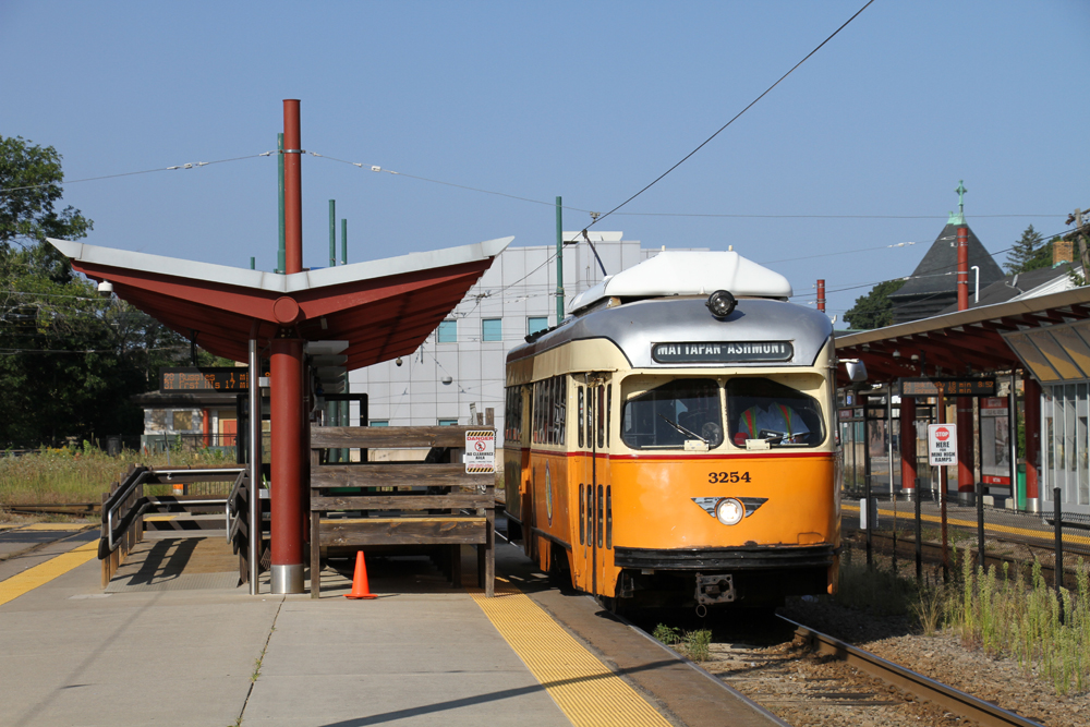 Orange PCC streetcar at station