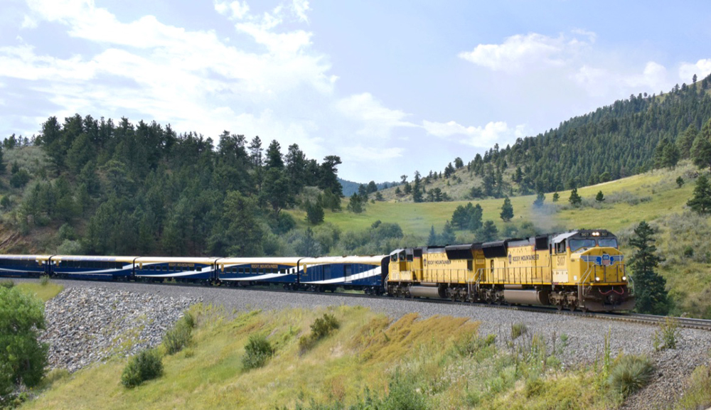 Passenger train in foothills of Rocky Mountains