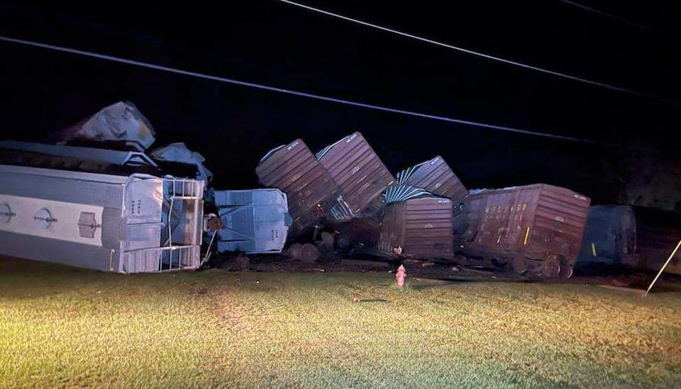 Derailed freight cars side by side perpendicular to track