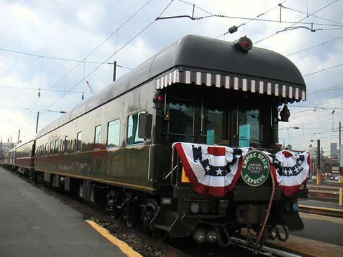 Dark green heavyweight private car with rear platform