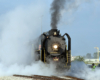 Steam locomotive shrouded by steam.