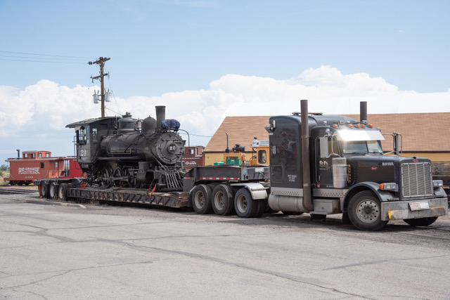 Steam locomotive on truck trailer