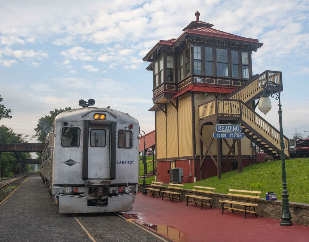 Stainless steel railcar at ornate station