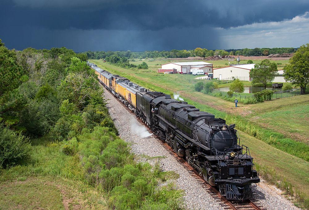 Large black steam locomotive with train against a dark blue sky. More of the Big Boy story.