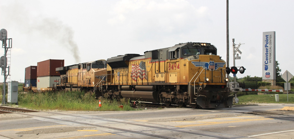 Container train with two yellow locomotives