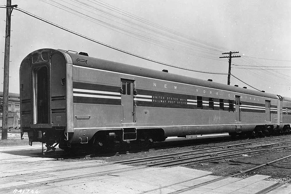 Three-quarter view of railroad passenger car with side loading doors