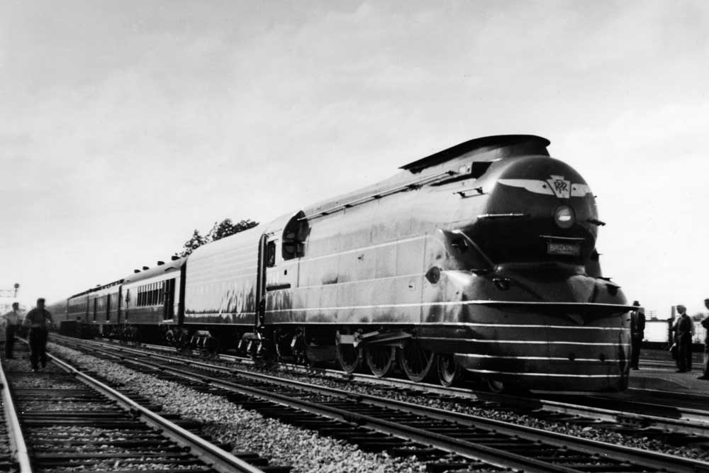 Streamlined steam locomotive on multiple-track main line