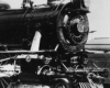 Black-and-white photo of front portion of 4-6-2 steam locomotive 