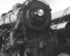 Black-and-white photo of front portion of 4-6-2 steam locomotive.