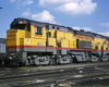 Broadside color photo of Union Pacific road-switcher diesel locomotive.