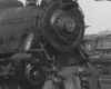 Black-and-white photo of front portion of 4-6-2 steam locomotive.