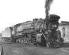 Black-and-white three-quarter-angle photo of 2-10-2 steam locomotive.