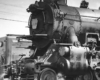 Black-and-white photo of front portion of 4-6-2 steam locomotive.