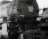 Black-and-white photo of front portion of 4-6-2 steam locomotive.