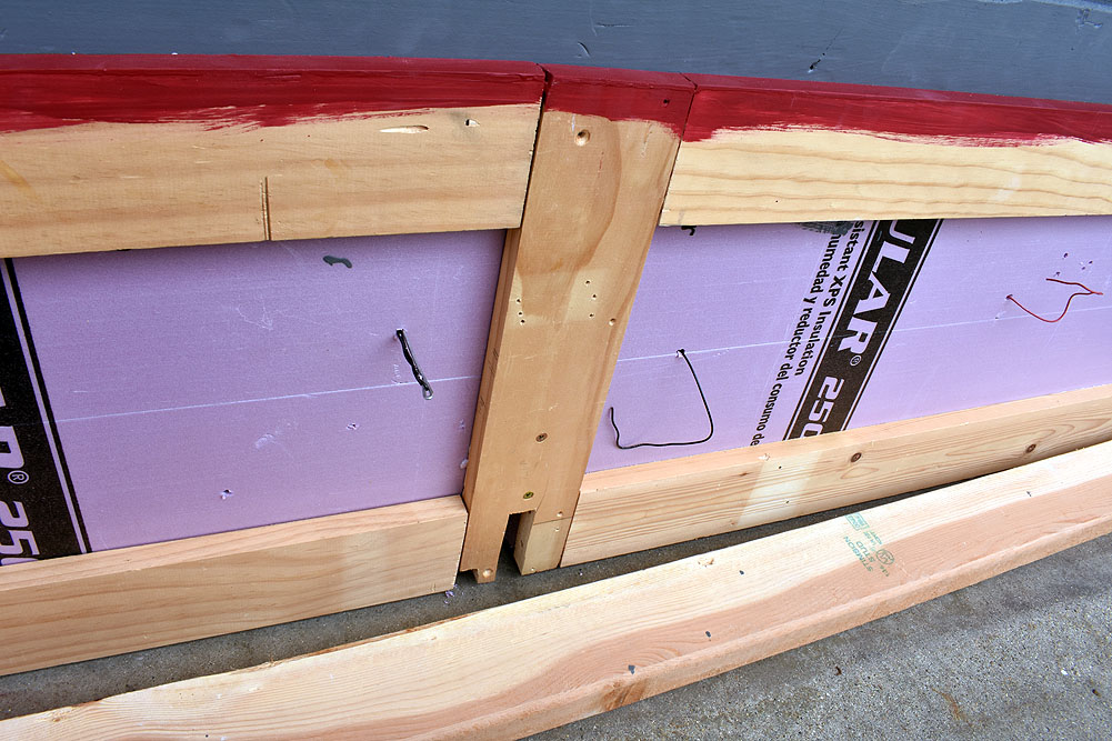 Bottom of layout surface, pink foam attached to 1 x 4 frame with wires poking out of surface