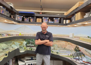 Steve Brown next to his layout