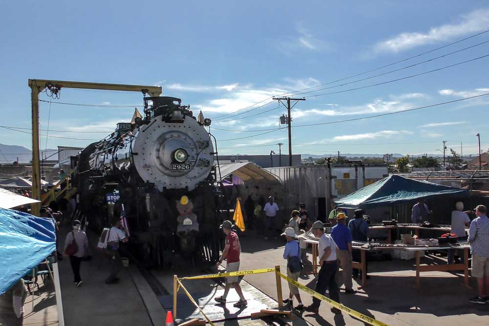 People admire restored steam locomotive