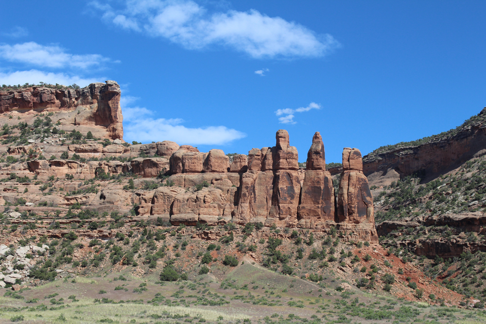 Red rock formations under blue skies