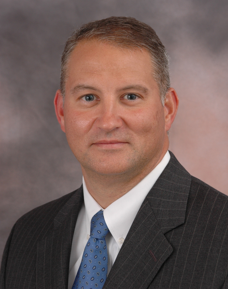 Formal portrait of man in suit and tie