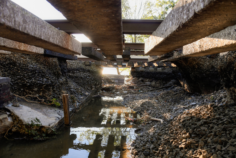 Railroad track hanging over washed-out underbed