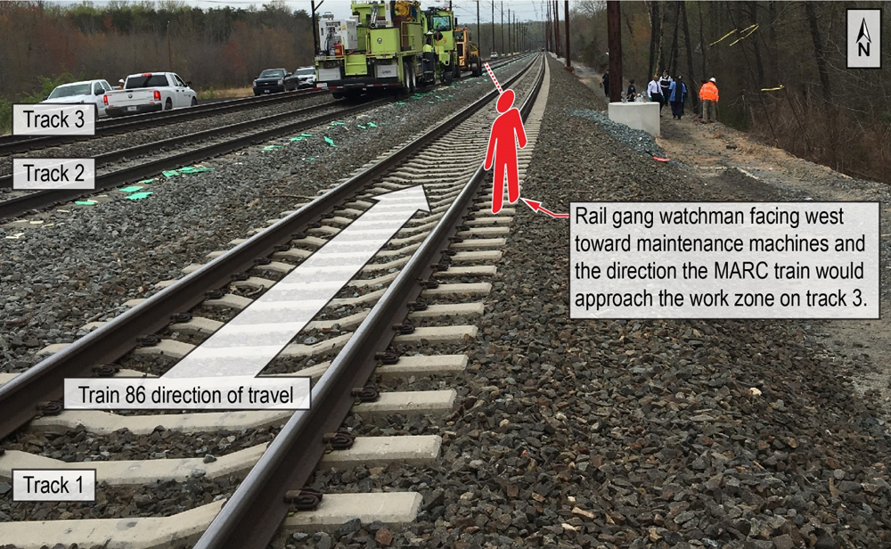 Photo of three-track main line with illustration showing details of accident