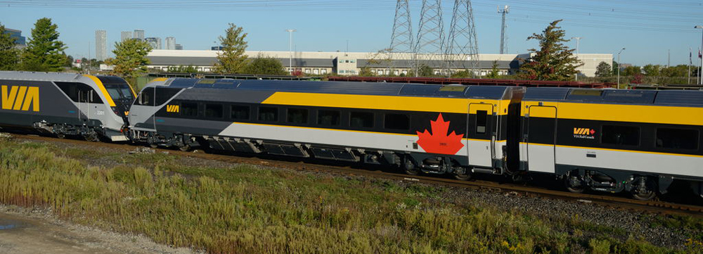 Blue, yellow, and gray passenger equipment