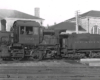 Black-and-white left-side photo of Camelback 0-4-0 steam locomotive at rest