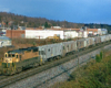 Color photo of road-switcher diesel locomotive with Reading Company freight train