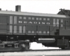 Black-and-white broadside photo of road-switcher diesel locomotive at rest