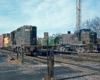 Color photo of two road-switcher diesel locomotives on adjacent tracks