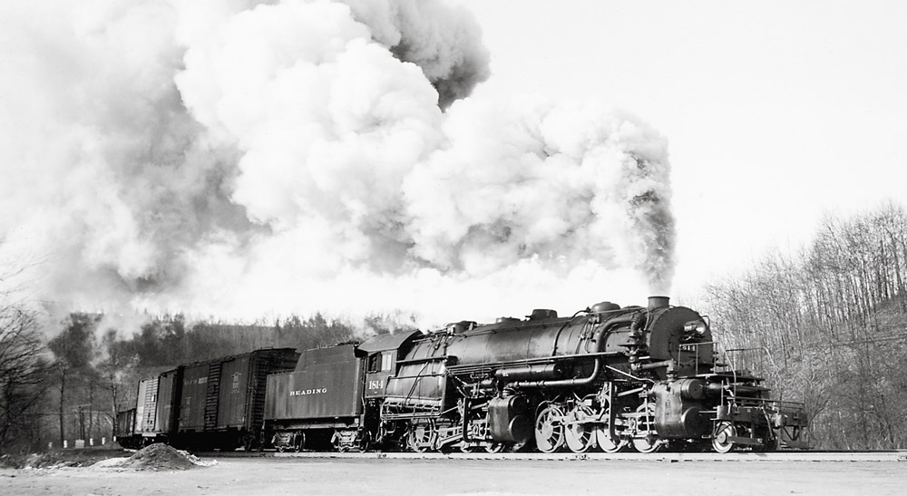 Black-and-white right-side photo of 2-8-8-0 steam locomotive in action