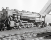 Black-and-white left-side photo of 2-10-2 steam locomotive at rest