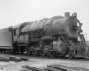 Black-and-white three-quarter left-side photo of 2-8-0 steam locomotive at rest