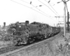 Black-and-white photo of two road-switcher diesel locomotives with Reading Company freight train